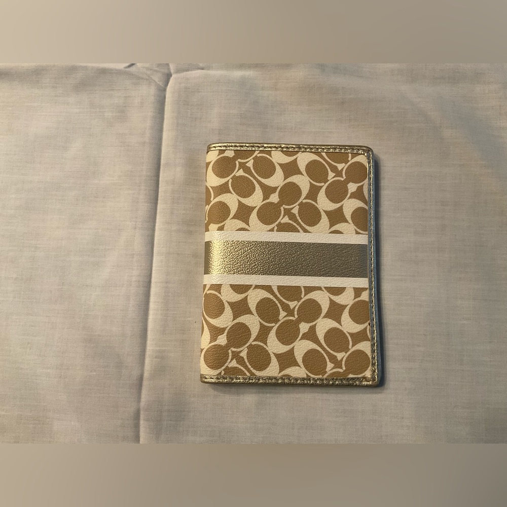 Coach gold leather passport case.